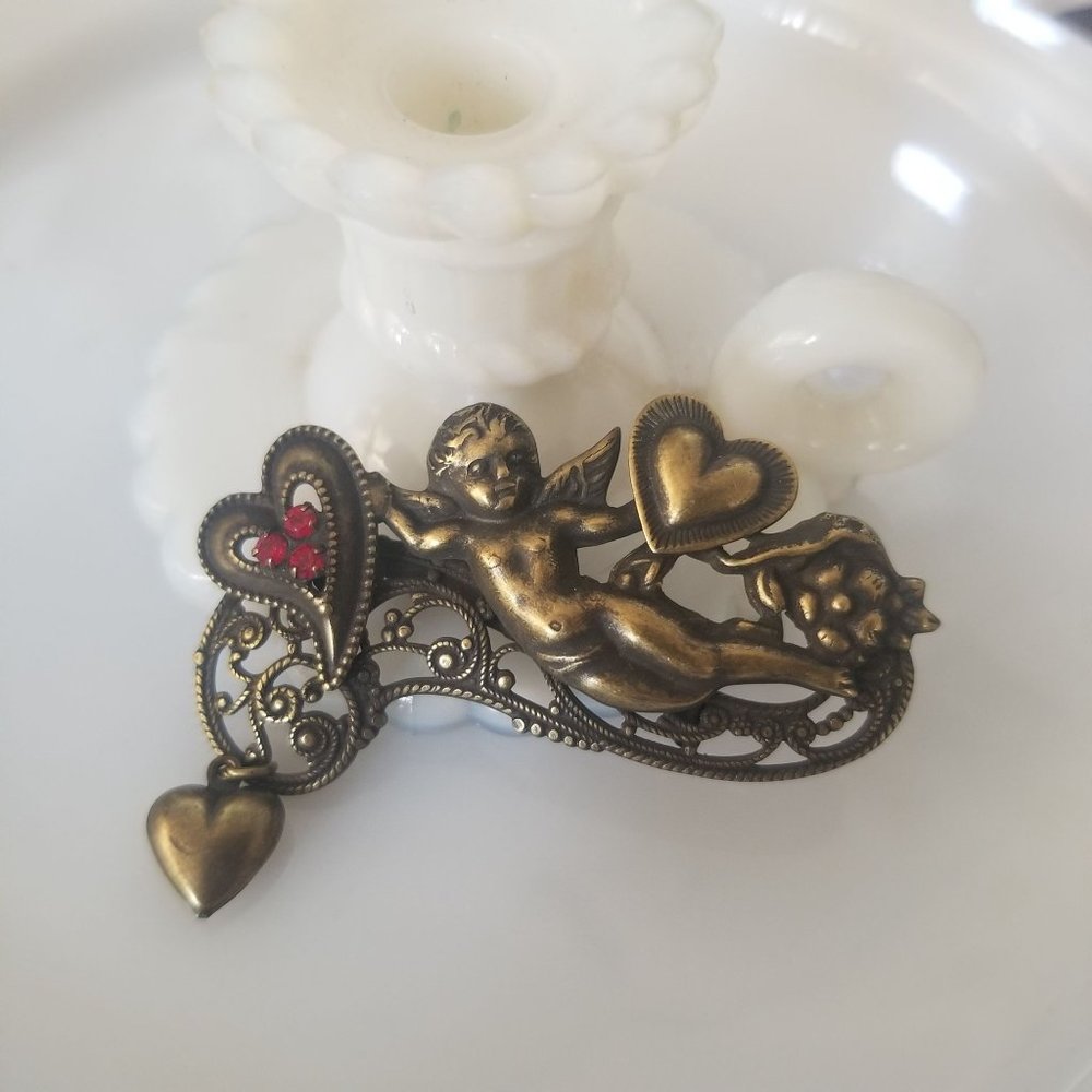 Vintage Victorian Filigree Cupid Brooch with Red Rhinestones